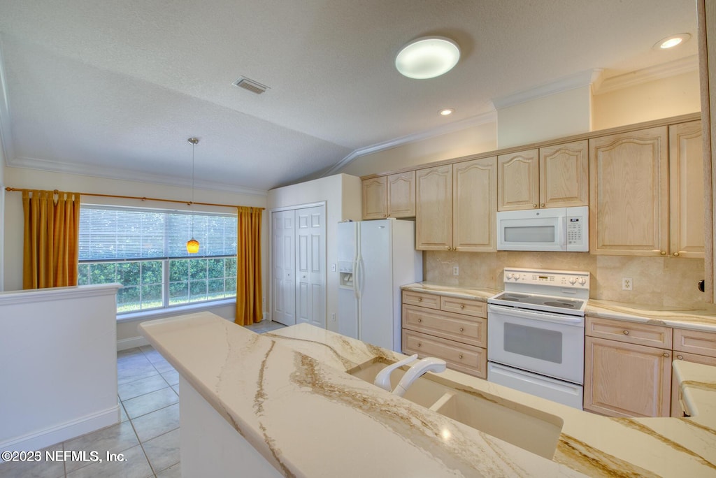 kitchen featuring visible vents, white appliances, light brown cabinetry, and light stone countertops