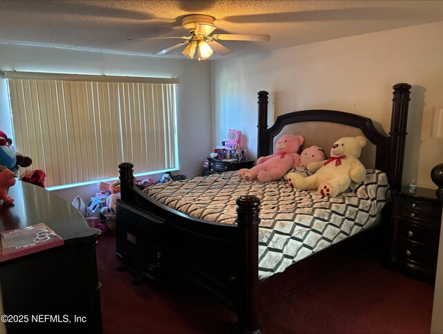 bedroom with a textured ceiling and ceiling fan