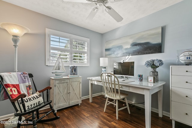 office space with a textured ceiling, baseboards, dark wood-style flooring, and ceiling fan