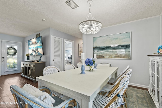 dining room featuring visible vents, baseboards, an inviting chandelier, and dark wood-style flooring