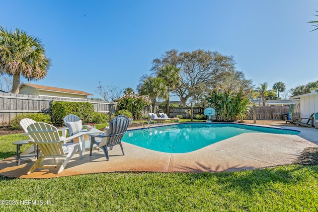 view of swimming pool featuring a fenced backyard, a fenced in pool, and a patio