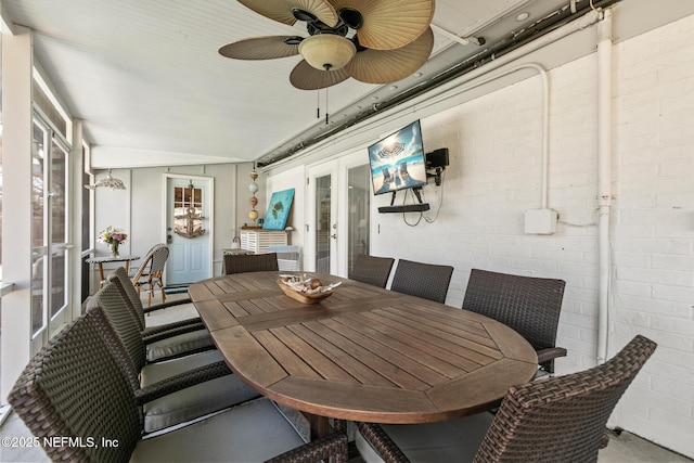 sunroom / solarium with french doors and a ceiling fan