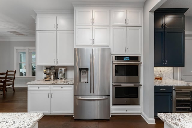 kitchen with white cabinetry, dark wood-style floors, light stone countertops, and appliances with stainless steel finishes