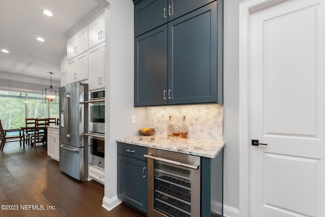 kitchen featuring dark wood finished floors, recessed lighting, stainless steel appliances, decorative backsplash, and wine cooler