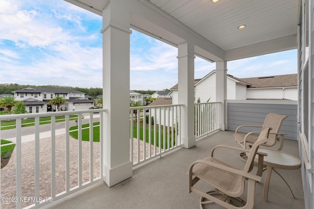 balcony featuring a residential view and a sunroom