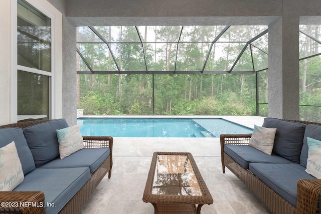 outdoor pool featuring a patio, a lanai, and outdoor lounge area