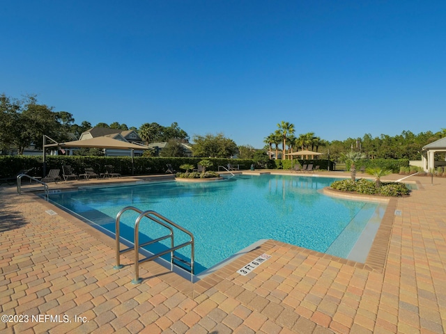 pool with a patio area