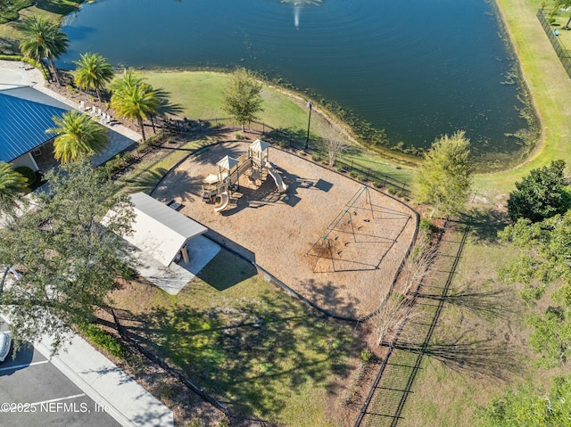 birds eye view of property with a water view