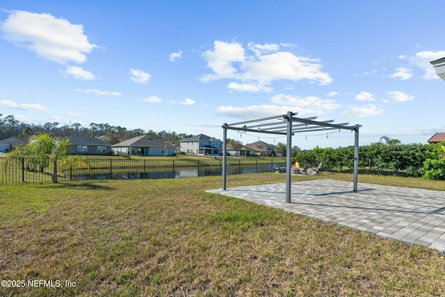 view of yard featuring a residential view, a patio, fence private yard, and a pergola