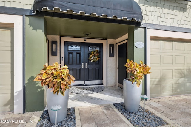 entrance to property featuring a garage