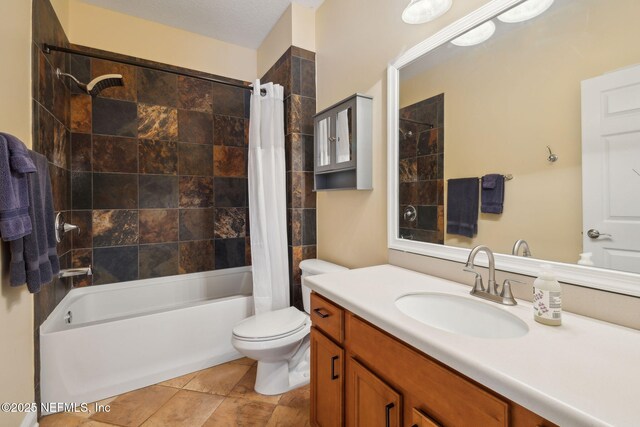 bathroom featuring vanity, toilet, and shower / bath combo