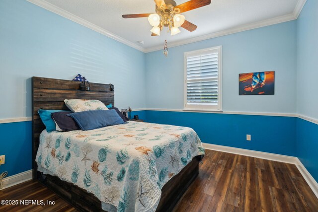 bedroom with baseboards, a ceiling fan, wood finished floors, and crown molding