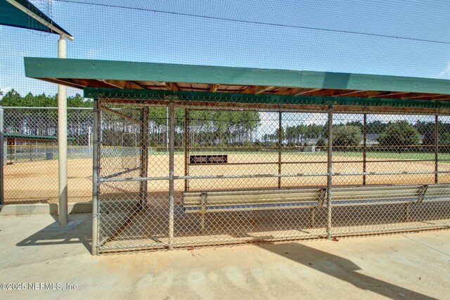 view of home's community featuring fence