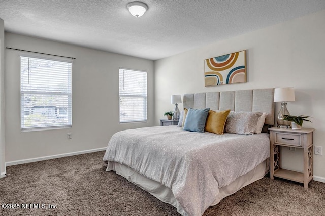 bedroom with carpet flooring, baseboards, and a textured ceiling