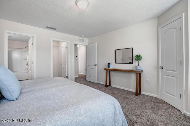 bedroom featuring visible vents, baseboards, carpet, and a textured ceiling