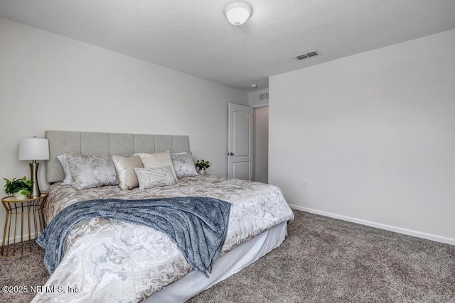 bedroom featuring visible vents, baseboards, carpet, and a textured ceiling