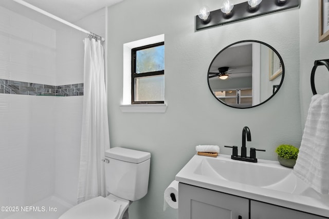 full bath featuring vanity, curtained shower, and toilet