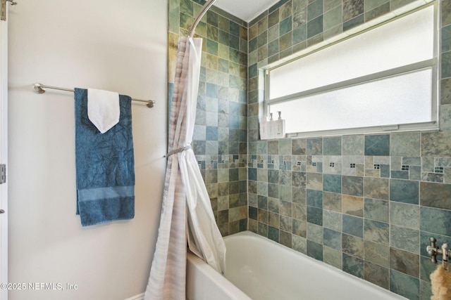 bathroom featuring shower / bathtub combination with curtain