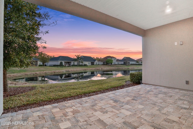 patio terrace at dusk with a water view