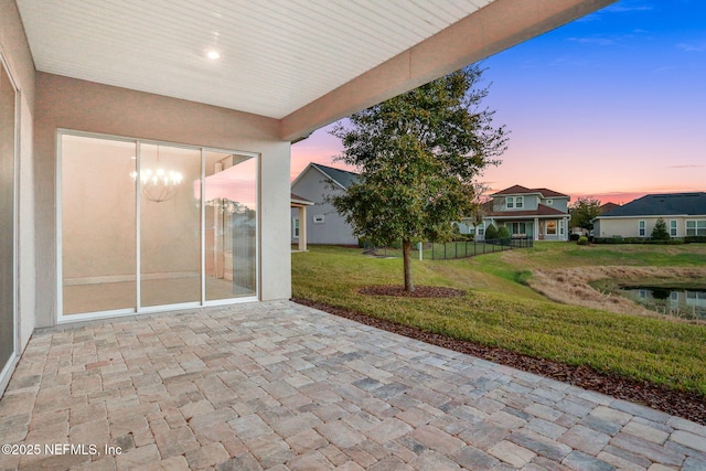 patio terrace at dusk with a lawn