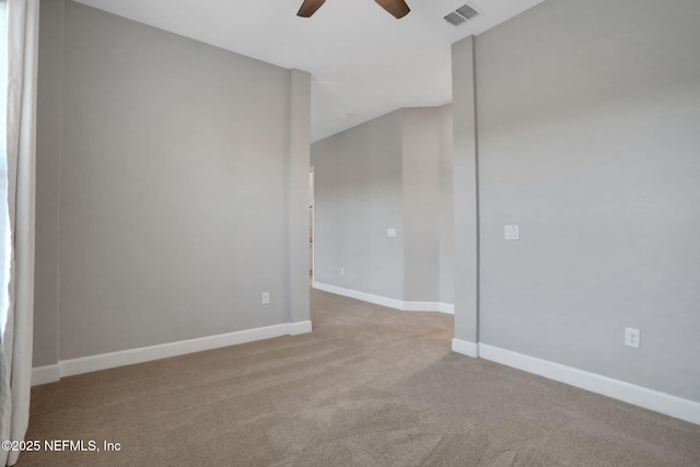 unfurnished room with a ceiling fan, baseboards, visible vents, and carpet floors