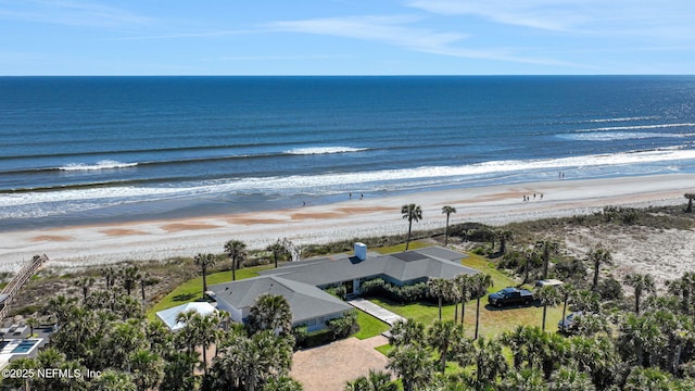 birds eye view of property featuring a water view and a view of the beach