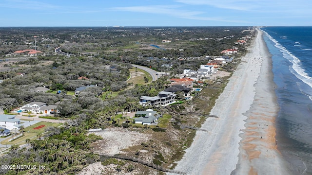 aerial view with a water view and a view of the beach