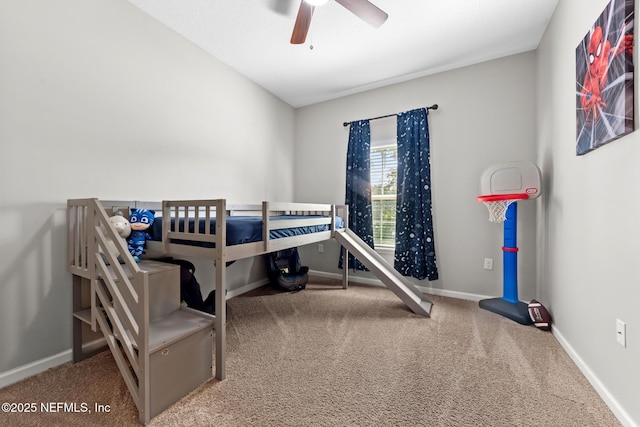 carpeted bedroom with a ceiling fan and baseboards