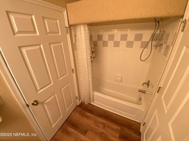 full bathroom with shower / bath combo with shower curtain and wood finished floors