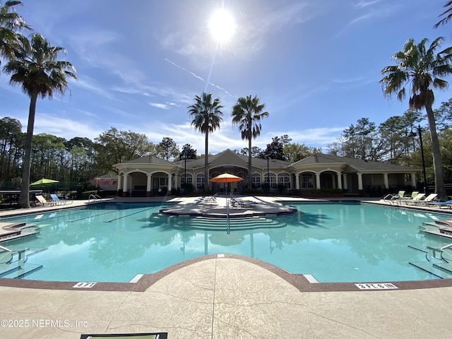 community pool featuring a patio area