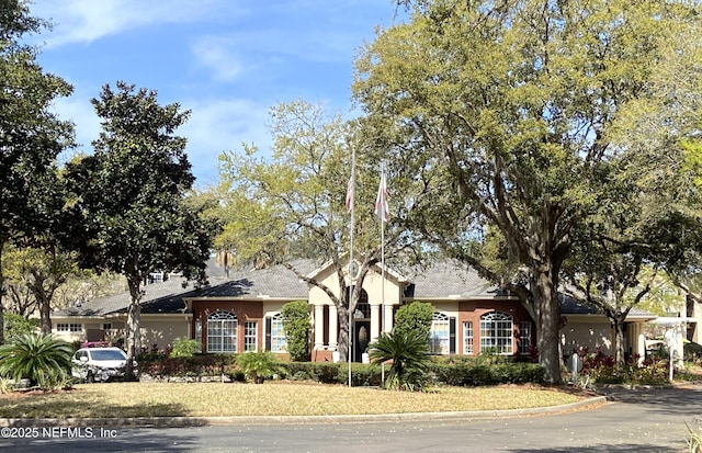 single story home featuring stucco siding