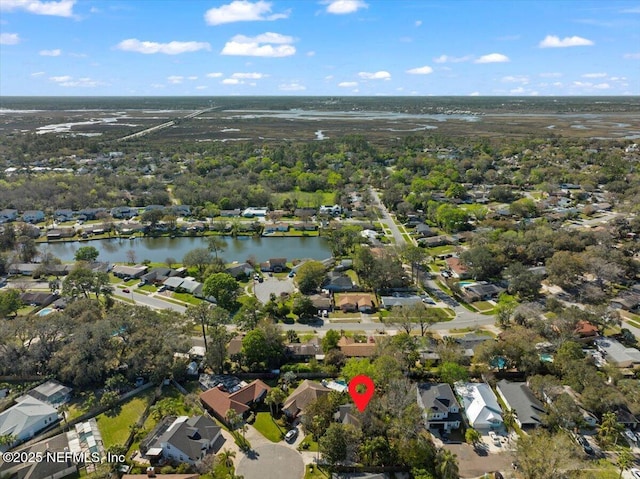 bird's eye view featuring a residential view and a water view