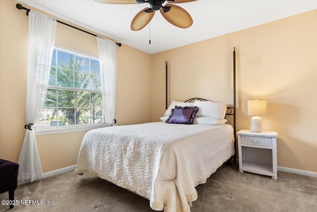 bedroom with baseboards, carpet, and a ceiling fan