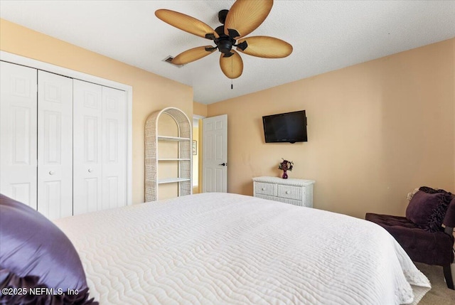 bedroom featuring a closet, visible vents, and ceiling fan