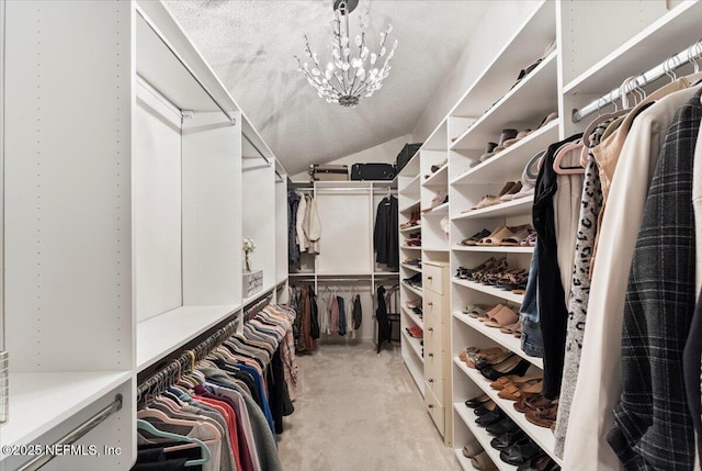 walk in closet with lofted ceiling