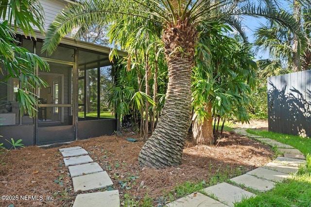 view of yard with a sunroom