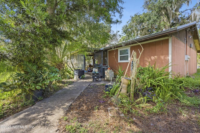 view of property exterior with a patio area