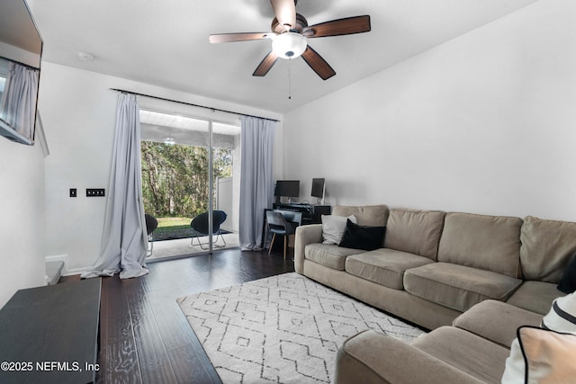 living room featuring dark wood finished floors and a ceiling fan