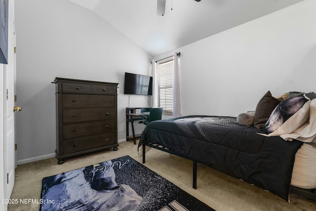 bedroom featuring baseboards, light carpet, ceiling fan, and vaulted ceiling