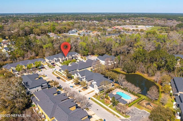 bird's eye view featuring a residential view and a water view