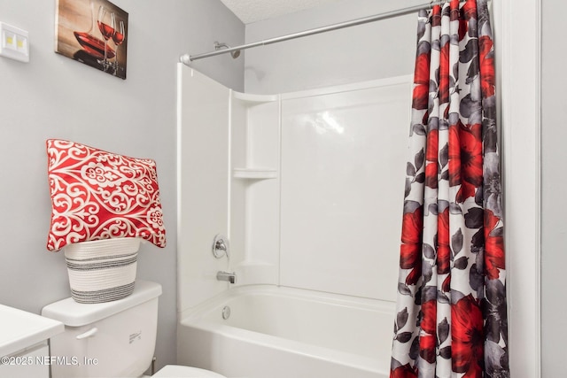 bathroom featuring toilet, shower / bathtub combination with curtain, and a textured ceiling