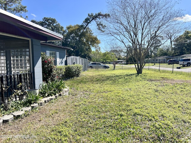 view of yard with fence