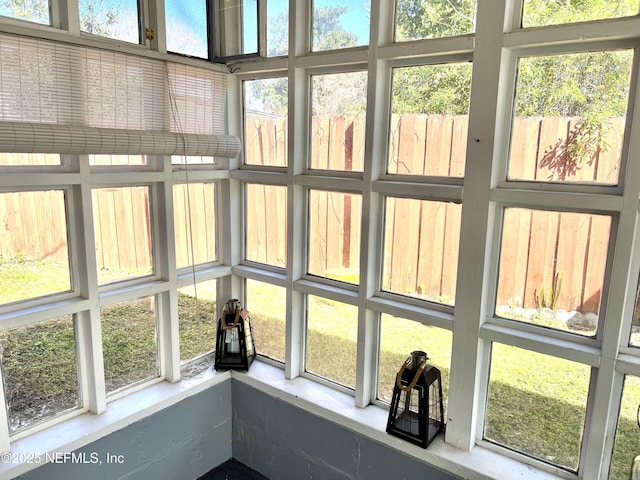 sunroom featuring a healthy amount of sunlight