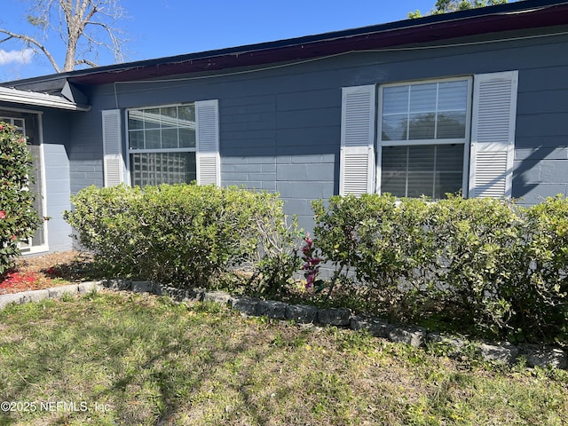 view of home's exterior featuring concrete block siding