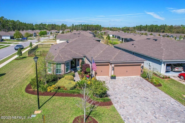 203 Country Brook Ave, Ponte Vedra, FL 32081 - view of front of home with decorative driveway, a residential view, a front yard, and an attached garage