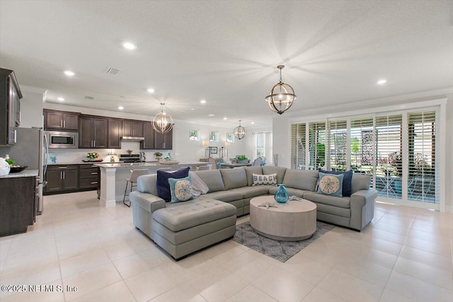 203 Country Brook Ave, Ponte Vedra, FL 32081 - living room featuring recessed lighting, a notable chandelier, ornamental molding, and light tile patterned floors