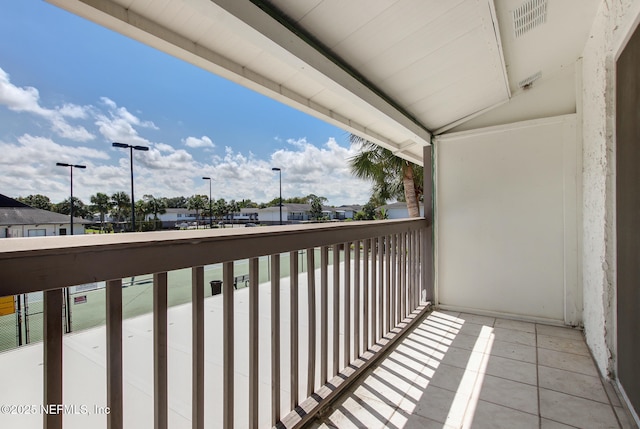 balcony featuring visible vents and a residential view