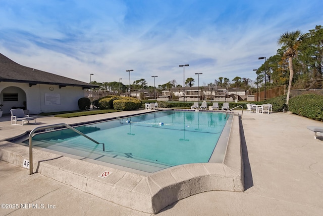 pool featuring a patio and fence