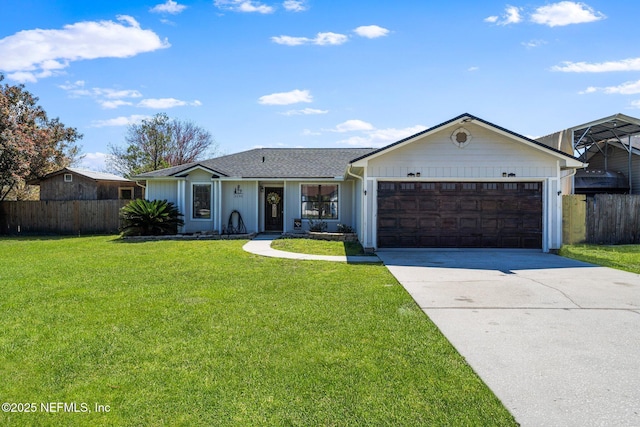 ranch-style house featuring a garage, concrete driveway, a front yard, and fence