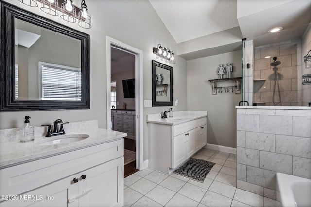 bathroom with lofted ceiling, two vanities, a tile shower, a sink, and tile patterned flooring